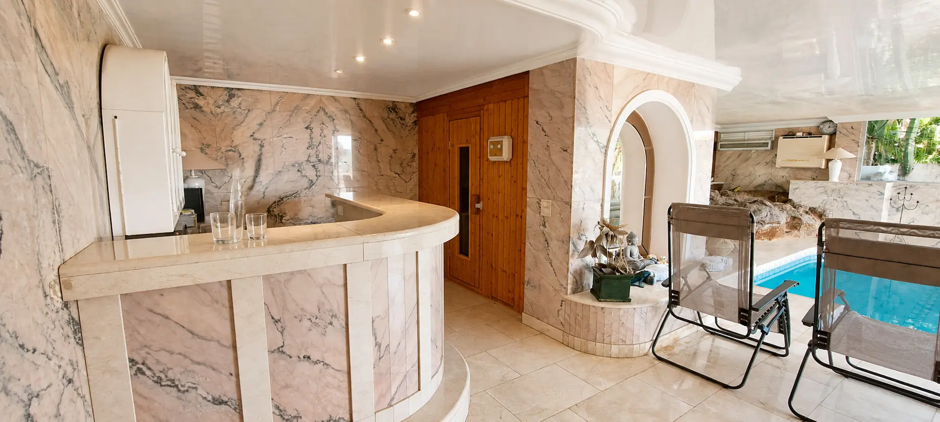 Heated indoor pool and lounge at Villa Larnia