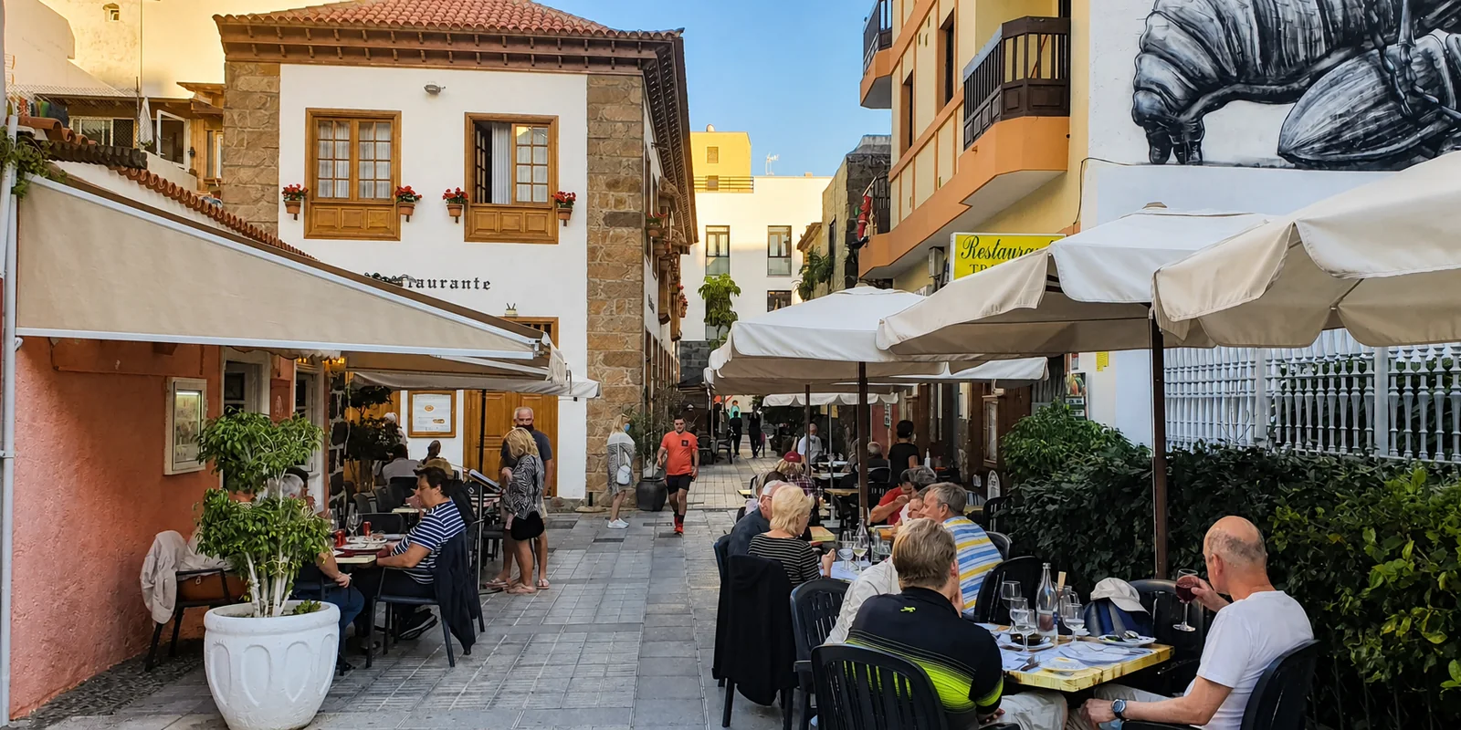 Lively street and restaurant terraces in Puerto de la Cruz, Tenerife